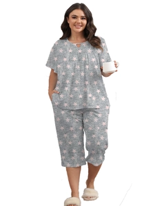 Detail of plus size sleepwear showing teardrop cutout neckline and pink star print