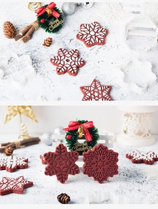 Detailed close-up of 3D snowflake and star cookie cutters with festive holiday treats
