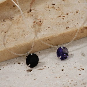 Three-prong minimalist pendant necklace with black and purple zircon on clear fishing line