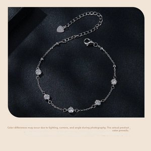 Detail of 925 sterling silver bracelet with five round-cut zircons and lobster clasp