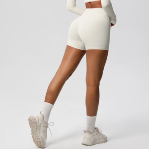 Side view of off-white high-waisted yoga shorts with seamless fabric and push-up effect