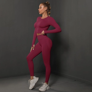 Detail of dark burgundy seamless yoga set featuring crop top and high waist leggings