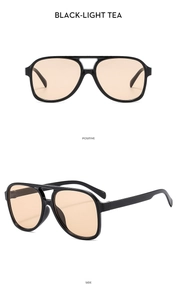 Detailed front and side views of black double-bridge aviator sunglasses with tea lenses