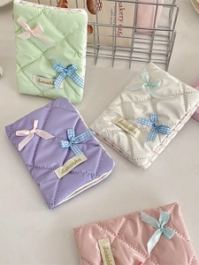 Quilted bow passport holder and card organizer set in mint, violet, cream, and pink