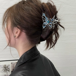Liquid blue butterfly claw clip for elegant hair styling on silver metal frame