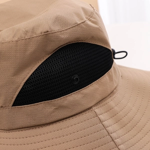 Close-up of khaki ripstop fabric and breathable mesh detail on outdoor sun visor hat