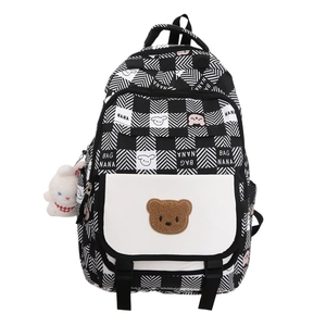Cute black and white checkered school backpack for girls featuring a 3D bear decoration