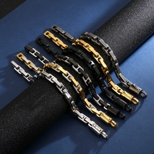 Detail of hip hop geometric chain bracelets in silver, gold, and black steel finishes