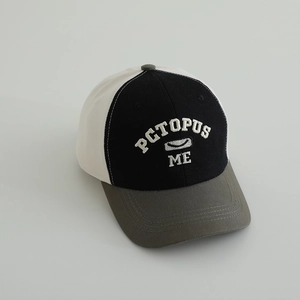 Detailed close-up of color-block baseball cap with 3D ME embroidery and twill cotton texture