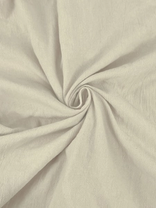 Close-up of beige cotton linen fabric texture with a natural spiral weave pattern