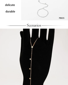 Detail showing delicate star charms on fine chains in both silver and gold finish
