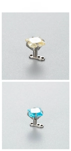 Detail of 6mm square zircon dermal anchor jewelry in yellow and sky blue colors