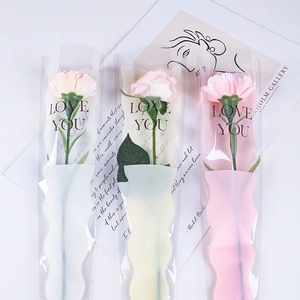 Three-piece artificial flowers in wavy love you cellophane bags with artistic card