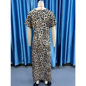 Detail view of leopard print maxi dress showing back cut and fabric texture on a mannequin