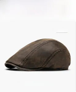 Macro view of textured coffee brown faux leather ivy cap showing stitching detail
