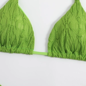 Detail of lime green textured bikini top with drawstring and triangle cup design