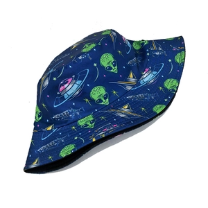Detail shot of navy bucket hat with green alien and UFO prints for outdoor fashion