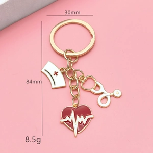 Golden medical nurse keychain with nurse hat, stethoscope, heart charm, 84mm length