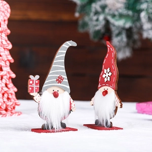 Handcrafted wooden Christmas gnome figurines with gift box for festive desktop decor