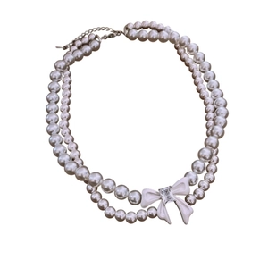 Elegant double-layer pearl necklace with zircon bow pendant and silver adjustable chain