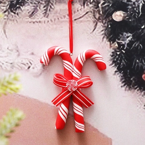 Christmas candy cane hanging ornament with red white stripes and festive bow detail