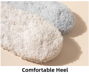 Close-up of the plush coral fleece fabric and durable heel detail on warm socks