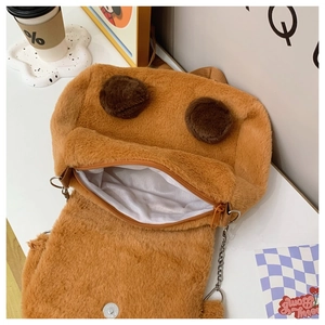 Detailed view of Capybara plush bag interior with chain strap and zipper closure