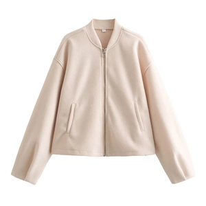 Detail of light pink women's jacket with metal zipper and size S neck label tag