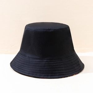 Classic black reversible bucket hat made of cotton canvas fabric for sun protection