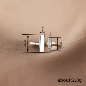 Minimalist silver square open ring with sparkling cubic zirconia on brown silk