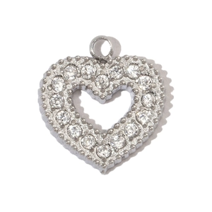 Detailed view of heart-shaped silver pendant with zircon inlays on white background