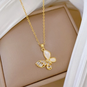 Elegant gold titanium steel necklace featuring a hollow butterfly shell and zircon pendant