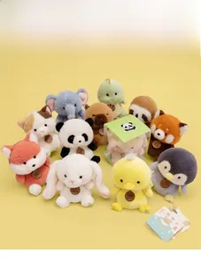 Collection of plush animal toys featuring panda and elephant with mini display box