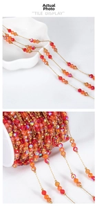 Detailed view of red faceted crystal bead chain with gold-plated stainless steel wire link