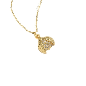 Polished gold ladybug pendant necklace with sparkling white zircon crystals for women