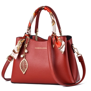 Elegant red wedding leather handbag with silk scarf handle and golden leaf pearl charm