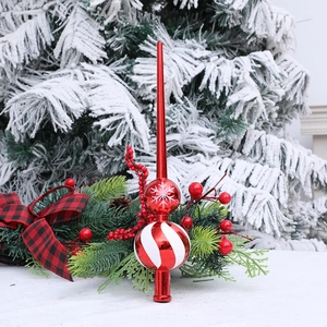Red Christmas tree topper with white snowflake pattern and striped sphere decoration