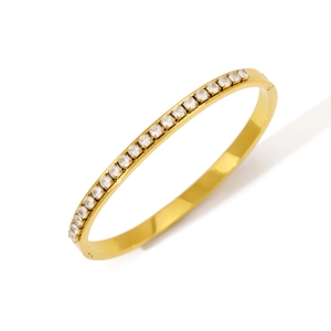 Elegant gold plated stainless steel bangle featuring a full row of sparkling zircons