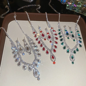 Detailed view of elegant drop tassel necklace and earring sets in multiple colors
