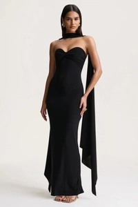 Close-up of black backless halter neck maxi dress with unique draped ribbon detail