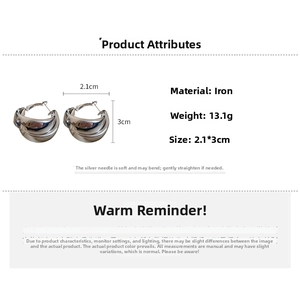 Silver twisted C-shape metal hoop earrings featuring 2.1cm x 3cm dimensions and 13.1g weight