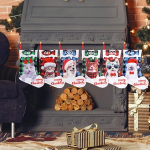 Plaid Christmas stockings with pet prints hanging on a fireplace mantel for home decor
