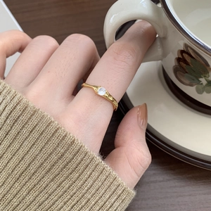 Irregular S925 sterling silver ring with zircon worn by model in a cozy lifestyle setting