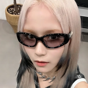 Modern Y2K black cat-eye sunglasses with purple gradient lenses and punk claw necklace