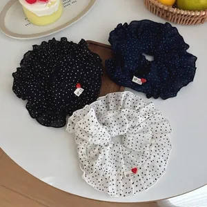 Polka dot ruffle scrunchie set with heart button labels in black, blue and white colors