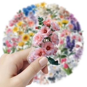 Close-up of pink flower petal PET sticker being held for DIY phone case decoration