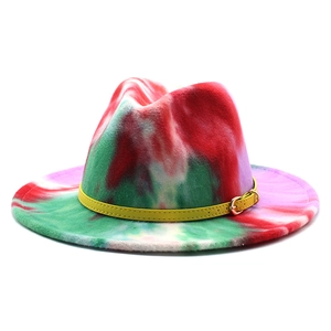 Detail of wool fedora featuring colorful tie-dye patterns and a yellow leather buckle band