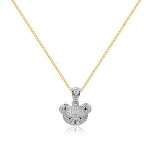 Macro detail of iced-out teddy bear pendant on gold chain with sparkling rhinestones