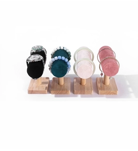 Detail view of T-bar jewelry stands in velvet and wood for watches and bracelets