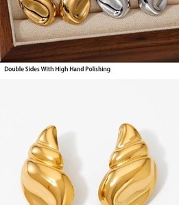 Detailed view of gold shell earrings featuring a high hand-polished metallic finish